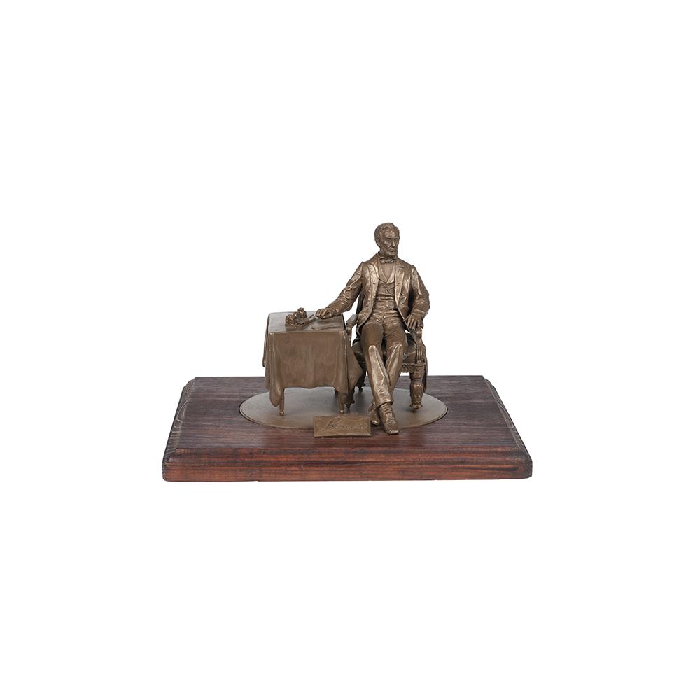 Image: President Lincoln seated at table