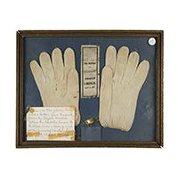 Image: gloves, ribbon, and button worn at Abraham Lincoln's funeral